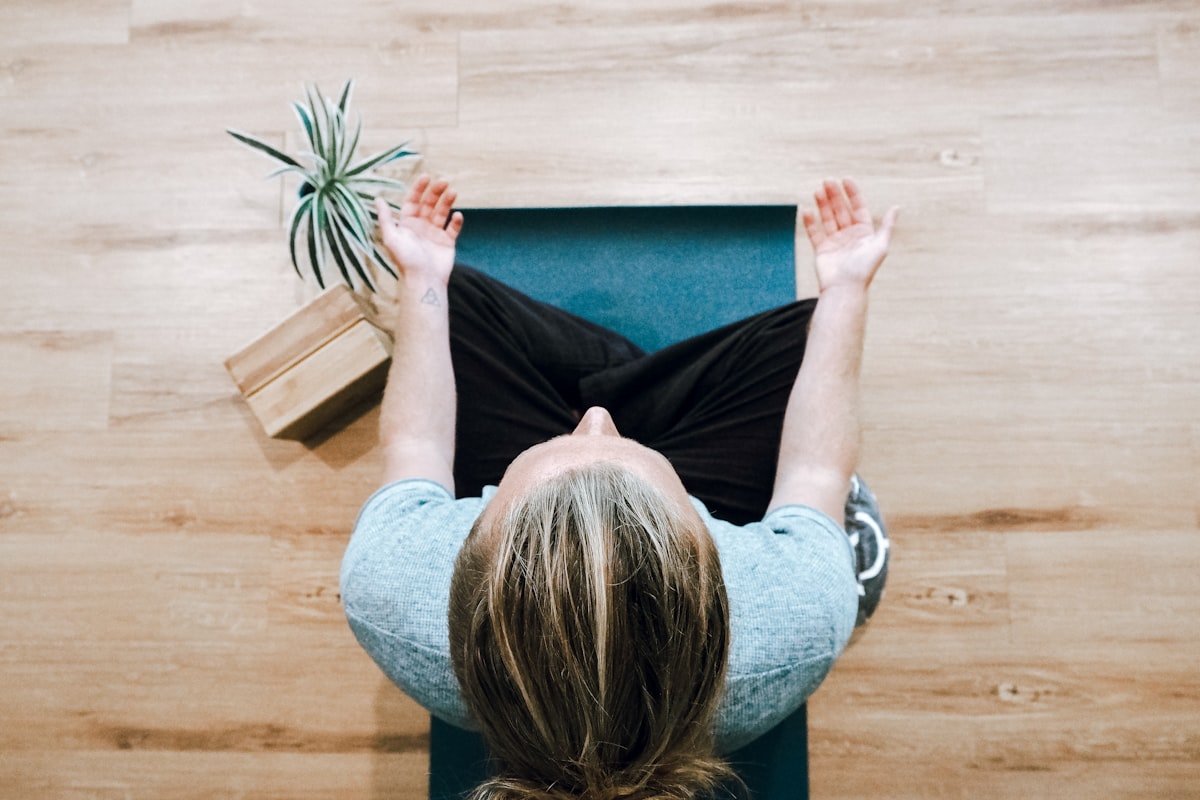 Woman demonstrating downward facing dog yoga pose